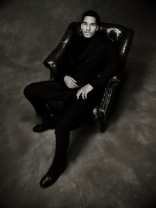 John Varvatos double-breasted wool jacket and leather lace-up boots; Nanushka extra-fine merino wool, nylon and elastane turtleneck; Bugatchi cotton and lyocell blend trousers.