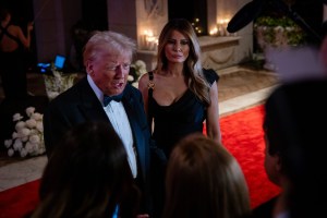 PALM BEACH, FLORIDA - DECEMBER 31: U.S. President-elect Donald Trump and his wife Melania Trump arrive on New Year's Eve at his Mar-A-Lago Club on December 31, 2024 in Palm Beach, Florida. Trump continues to fill posts in his upcoming administration ahead of his January 20 inauguration. (Photo by Eva Marie Uzcategui/Getty Images)