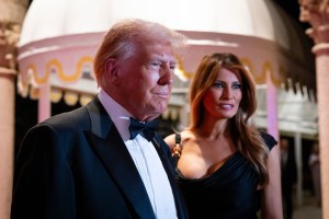 PALM BEACH, FLORIDA - DECEMBER 31: U.S. President-elect Donald Trump and his wife Melania Trump arrive on New Year's Eve at his Mar-A-Lago Club on December 31, 2024 in Palm Beach, Florida. Trump continues to fill posts in his upcoming administration ahead of his January 20 inauguration. (Photo by Eva Marie Uzcategui/Getty Images)