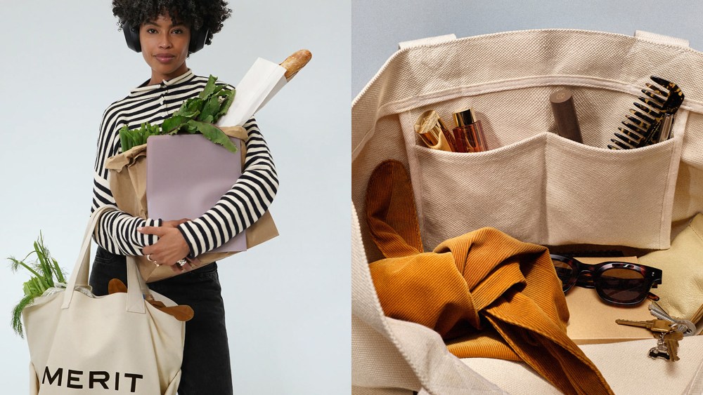 woman posing with a neutral colored tote bag while holding groceries; inside the tote bag, which features pockets and a roomy main compartment