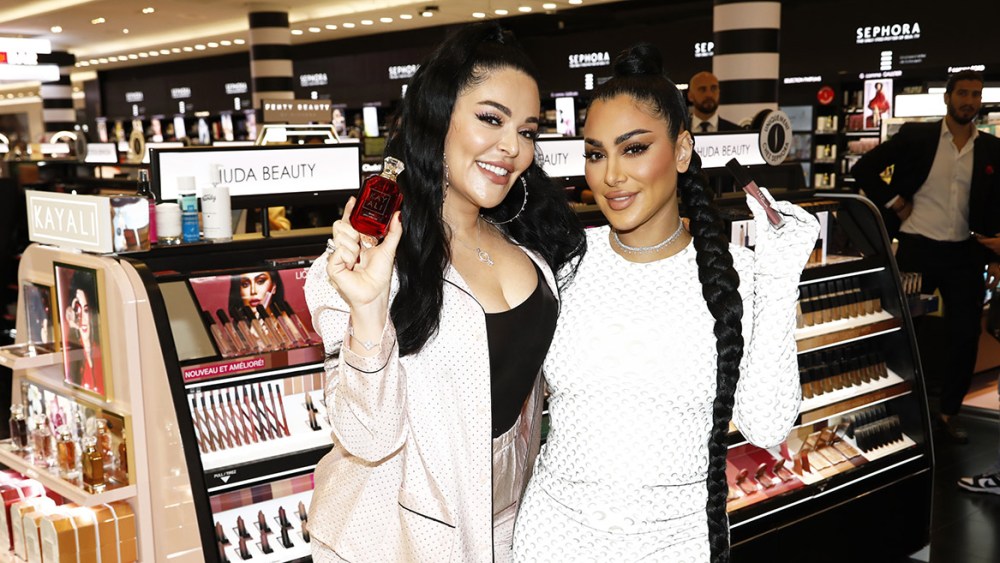 PARIS, FRANCE - JULY 01: Mona Kattan (L) and Huda Kattan are pictured while they visit the Sephora store on the Champs-Elys√©es during a Huda Beauty presentation on July 01, 2022 in Paris, France. (Photo by Julien M. Hekimian/Getty Images For Huda Beauty)