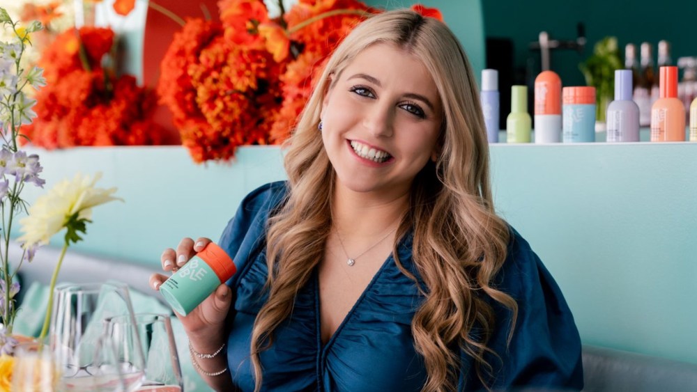 Shai Eisenman holding Bubble skin care product