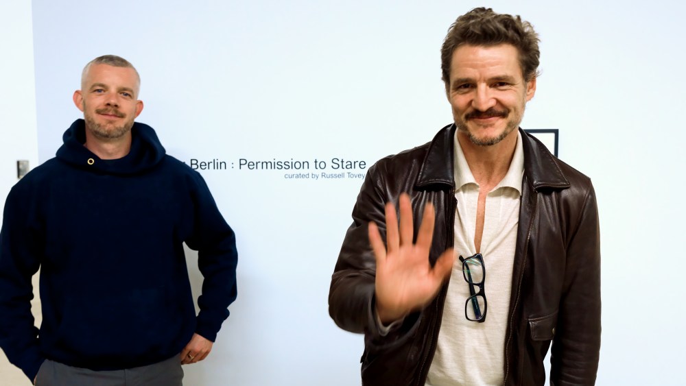 Curator Russel Tovey and Pedro Pascal pose for a picture inside the Mariposa Gallery along Western Ave in the Melrose Hill neighborhood in Los Angeles, California on February 18, 2025.
