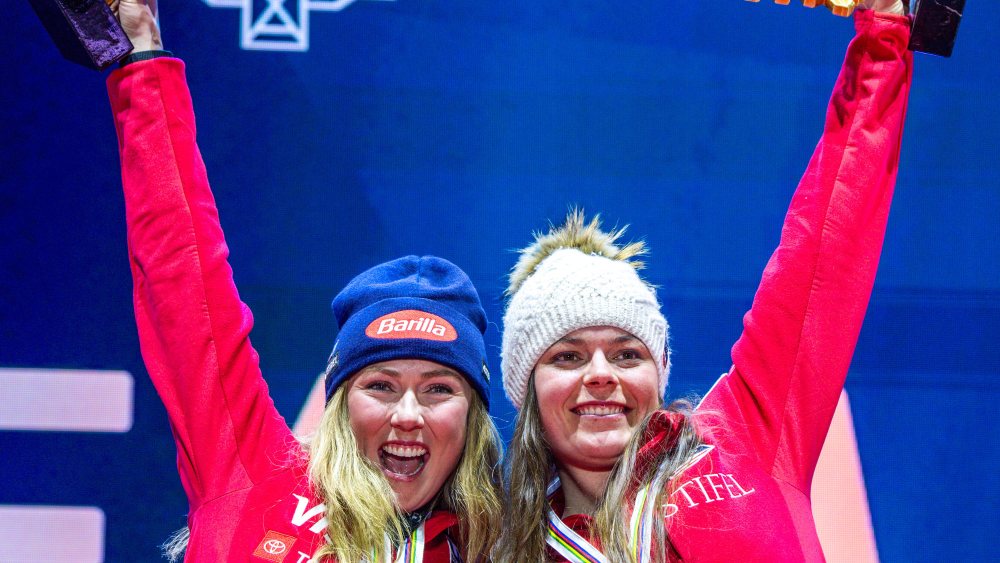 Alpine Skiing: World Championships, Team Combined, Ladies, Mikaela Shiffrin (l) and Breezy Johnson (r) from the USA sing the American national anthem at the medal ceremony after receiving their gold medals.