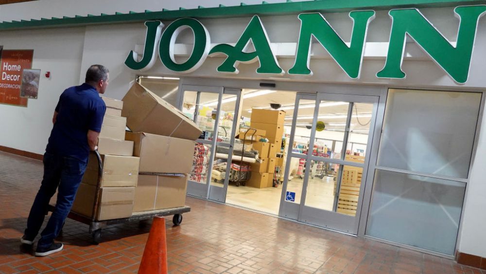 MIAMI, FLORIDA - FEBRUARY 13: A man unloads boxes into a JOANN Fabric and Crafts store slated to close on February 13, 2025 in Miami, Florida. The company announced it will be closing approximately 500 of its roughly 850 locations across the United States. (Photo by Joe Raedle/Getty Images)