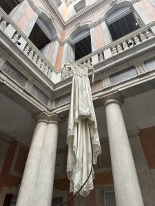 "Reminiscent of the installation ‘Forgotten Dream’ by David Hammond at Palazzo Grassi, fall 2025 evokes movement and elegance in time-worn lace, billowy fabrics and Venetian hues.” - Rebecca Hessel Cohen