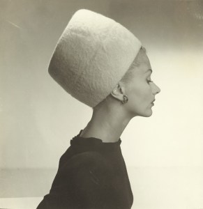Lisa Fonssagrives wearing a "King Tut" sugarloaf hat in a photograph at the Maison Européenne de la Photographie.