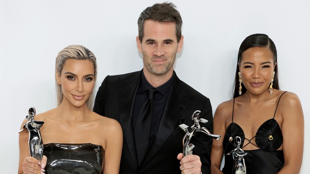Kim Kardashian, Jens Grede and Emma Grede pose with the Amazon Innovation Award during the CFDA Fashion Awards on Nov. 07, 2022.