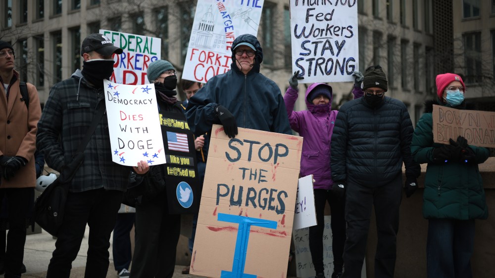 WASHINGTON, DC - FEBRUARY 05: Protesters rally outside of the Theodore Roosevelt Federal Building headquarters of the U.S. Office of Personnel Management on February 05, 2025 in Washington, DC. The group of federal employees and supporters are protesting against Elon Musk, tech billionaire and head of the Department of Government Efficiency (DOGE), and his aids who have been given access to federal employee personal data and have allegedly locked out career civil servants from the OPM computer systems. (Photo by Alex Wong/Getty Images)
