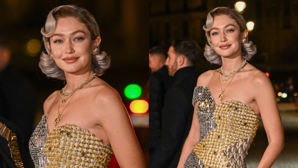 Gigi Hadid arrives at the Louvre's Grand Fashion Dinner on March 4 in Paris, metallic asymmetrical dress