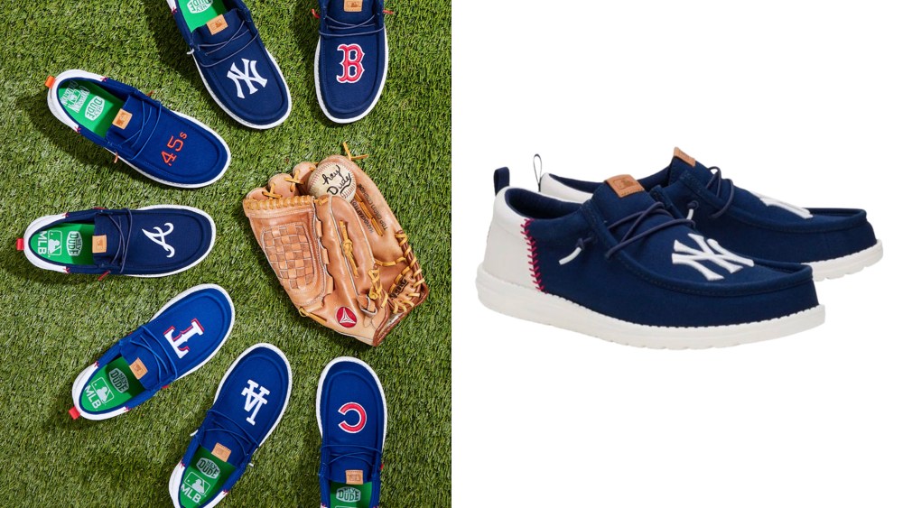 semicircle of shoes on grass next to a baseball mitt; shoe style from hey dude with the new york yankees logo on it