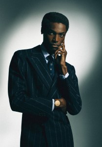 Louis Vuitton Tambour Convergence watch in rose gold with 37mm case; Cesare Attolini wool suit, cotton shirt and tie; Celine Homme by Hedi Slimane belt.