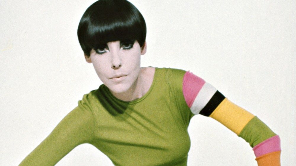 Peggy Moffitt wearing Rudi Gernreich's abstract "poison" green jersey maxi dress.