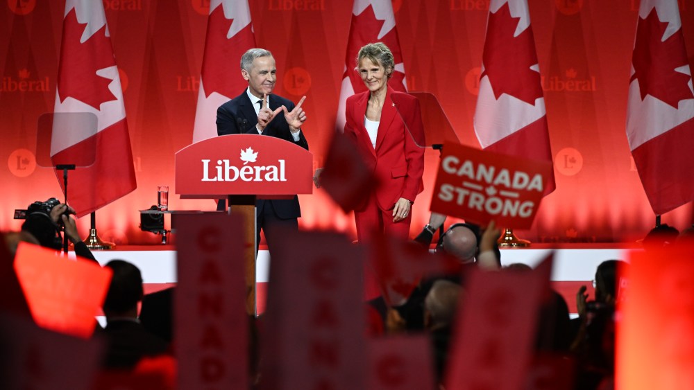OTTAWA, CANADA - MARCH 9: Mark Carney, newly elected as the leader of the Liberal Party of Canada, celebrates his victory with his wife, Diana Fox, following the official announcement of the 2025 Liberal Leadership race results at Rogers Centre, in Ottawa, Ontario, Canada, on March 9, 2025. (Photo by Stringer/Anadolu via Getty Images)