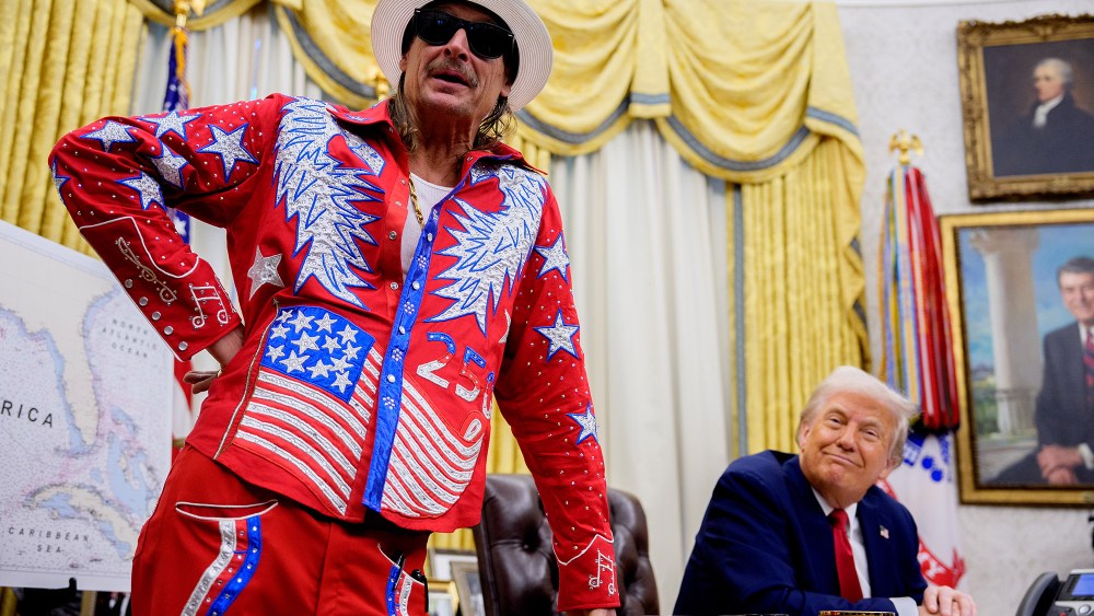 kid rock white house outfit, designer manuel cuevas, WASHINGTON, DC - MARCH 31: U.S. President Donald Trump listens as entertainer Kid Rock speaks during an executive order signing event in the Oval Office of the White House on March 31, 2025 in Washington, DC. Trump has signed an executive order against ticket scalping and reforming the live entertainment ticket industry. (Photo by Andrew Harnik/Getty Images)