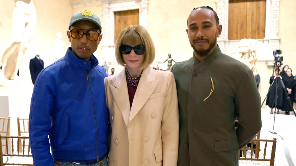 Met Gala celebrity Pharrell Williams and Lewis Hamilton pose with Vogue editor Anna Wintour at the Metropolitan Museum of Art's Costume Institute during a press conference October 9, 2024 to announce the Met Gala theme "Superfine: Tailoring Black Style," that will be launched by the Met Gala on May 5. (Photo by TIMOTHY A. CLARY / AFP) (Photo by TIMOTHY A. CLARY/AFP via Getty Images)