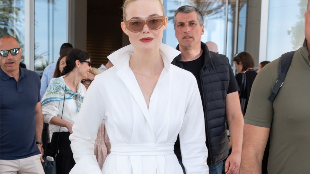 Elle Fanning wears Giuseppe Zanotti's Angular Heels and Max Mara Shirt Dress is seen at Hotel Martinez during day twelve of the 78th Cannes Film Festival on May 24, 2025 in Cannes, France.