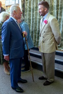 LONDON, ENGLAND - MAY 20: David Beckham wearing a David Austin Roses "King's Rose" speaks with King Charles III, patron of the Royal Horticultural Society during a visit to the RHS Chelsea Flower Show at Royal Hospital Chelsea on May 20, 2025 in London, England. (Photo by Paul Grover - WPA Pool/Getty Images)