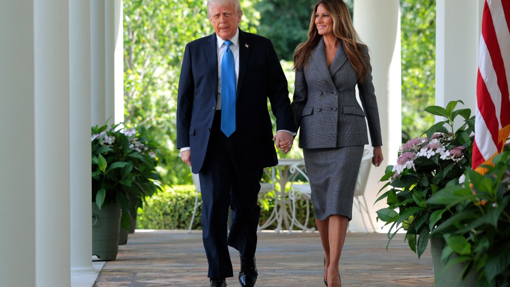 WASHINGTON, DC - MAY 19: U.S. President Donald Trump and First Lady Melania Trump arrive at the signing ceremony for the TAKE IT DOWN Act in the Rose Garden of the White House on May 19, 2025 in Washington, DC. The first lady made the Tools to Address Known Exploitation by Immobilizing Technological Deepfakes on Websites and Networks (TAKE IT DOWN) Act a priority, traveling to Capitol Hill to lobby lawmakers and show her support for the legislation, which addresses non-consensual intimate imagery, or "revenge porn," and artificial intelligence deepfakes posted online and to social media. (Photo by Chip Somodevilla/Getty Images)