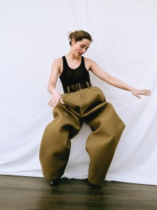 Marc Jacobs virgin wool boxy pant with leather belt; Dior top and bra. Necklace in yellow gold and diamonds, three rings in yellow gold and diamonds, 2 rings in  white gold and diamonds and yellow gold and diamond earrings. All Louis Vuitton Le Damier de Louis Vuitton collection.