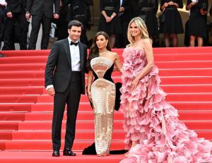 Carlos Sainz Jr., Eva Longoria, Heidi Klum at the Opening Ceremony and "Leave One Day" Premiere at the 78th Cannes Film Festival held at Palais des Festivals on May 13, 2025 in Cannes, France.