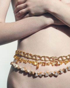 Pomellato Pentagoni necklace in 18-karat rose gold with white and brown diamonds; Roberto Coin 18-karat yellow gold Cialoma diamond knot necklace.
