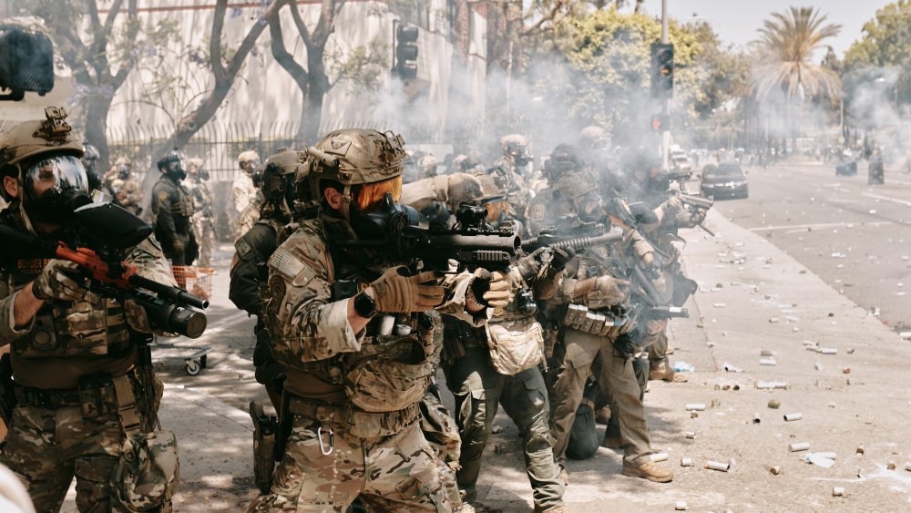 LOS ANGELES, CALIFORNIA - JUNE 7: Protests and confrontations between immigration rights supporters and law enforcement are seen taking place in Paramount, California, and downtown Los Angeles, California, United States on June 7, 2025, following recent raids by Immigration and Customs Enforcement (ICE) and Department of Homeland Security (DHS) agents. Demonstrators are seen using blockades and facing tear gas, flash bang grenades, and pepper ball shots, as rising tensions lead to damaged property across the affected areas. (Photo by Taurat Hossain/Anadolu via Getty Images)