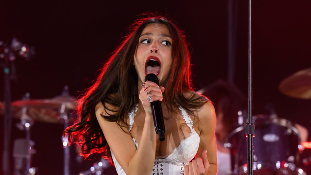 Olivia Rodrigo wears a red lip for her performance at Glastonbury Music Festival 2025.