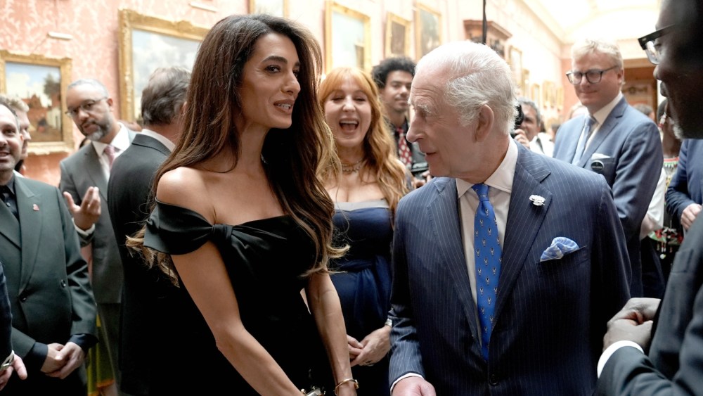 LONDON, ENGLAND - JUNE 25: Amal Clooney speaks with King Charles III attend a reception for the winners of the King's Trust Awards 2025 at Buckingham Palace on June 25, 2025 in London, England. (Photo by Stefan Rousseau-WPA Pool/Getty Images)