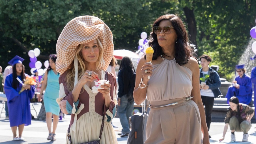 Actresses Sarah Jessica Parker wearing the "cloud" hat and Sarita Choudhury on the set of "And Just Like That." in Washington Square Park in New York.  