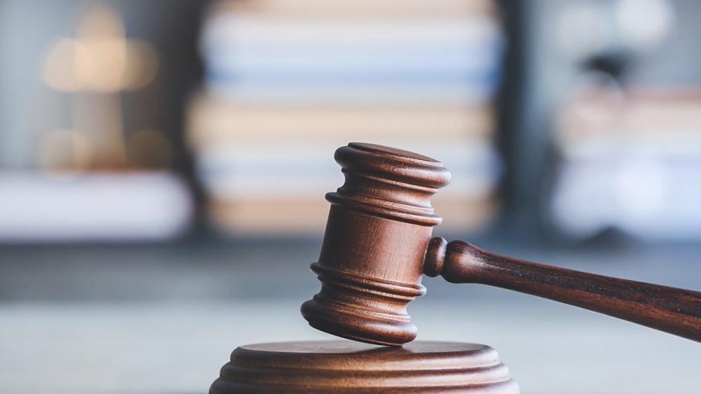 Judge's gavel on table in office