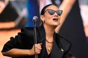 GLASTONBURY, ENGLAND - JUNE 29: Nadine Shah wears a Palestine flag badge as she performs on the Other Stage during day five of Glastonbury festival 2025 at Worthy Farm, Pilton on June 29, 2025 in Glastonbury, England. Established by Michael Eavis in 1970, Glastonbury has grown into the UK's largest music festival, drawing over 200,000 fans to enjoy performances across more than 100 stages. In 2026, the festival will take a fallow year, a planned pause to allow the Worthy Farm site time to rest and recover. (Photo by Leon Neal/Getty Images)