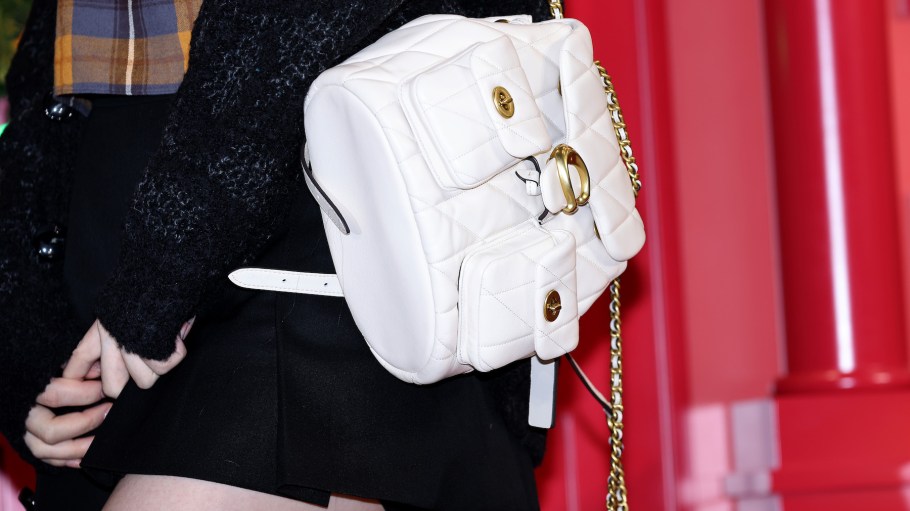 Chaeryeong, bag detail, of girl group ITZY poses for a photocall for Coach pop-up store opening at The Hyundai in Seoul, South Korea.