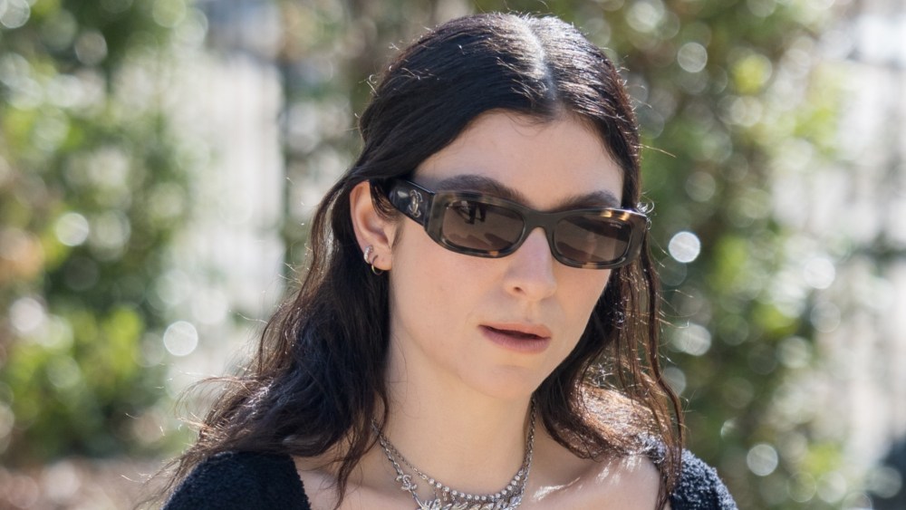 Lorde styles messy waves for the Chanel Fall 2025 Couture show.