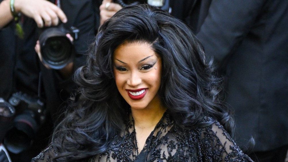 Cardi B dons grandiose hair extensions at the Balenciaga fall 2025 couture show.