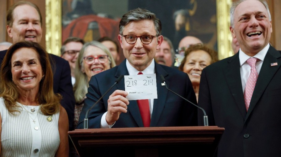 Speaker of the House Mike Johnson (R-La.) holds up the vote total on Thursday.