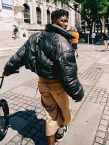Juun.J cow leather jacket over Acne Studios cotton tank top; Agbobly cotton shorts; Nigel Sylvester x Air Jordan 1 Low Better With Time; Nigel’s own jewelry.