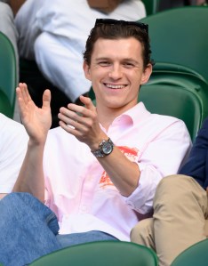LONDON, ENGLAND - JULY 08: Tom Holland reacts to the action court-side on day nine of the Wimbledon Tennis Championships at the All England Lawn Tennis and Croquet Club  on July 08, 2025 in London, England. (Photo by Karwai Tang/WireImage)