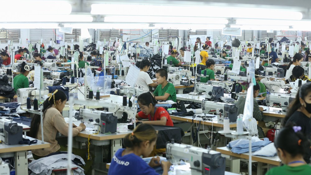 Employees make clothes for export at a garment factory in Yangon, Myanmar.