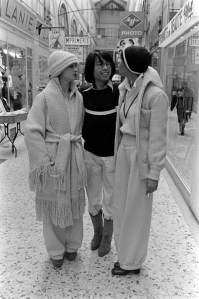 Kenzo, Carol LaBrie and model pose in the fall 1973 collection in the Passage Verdeau in Paris.