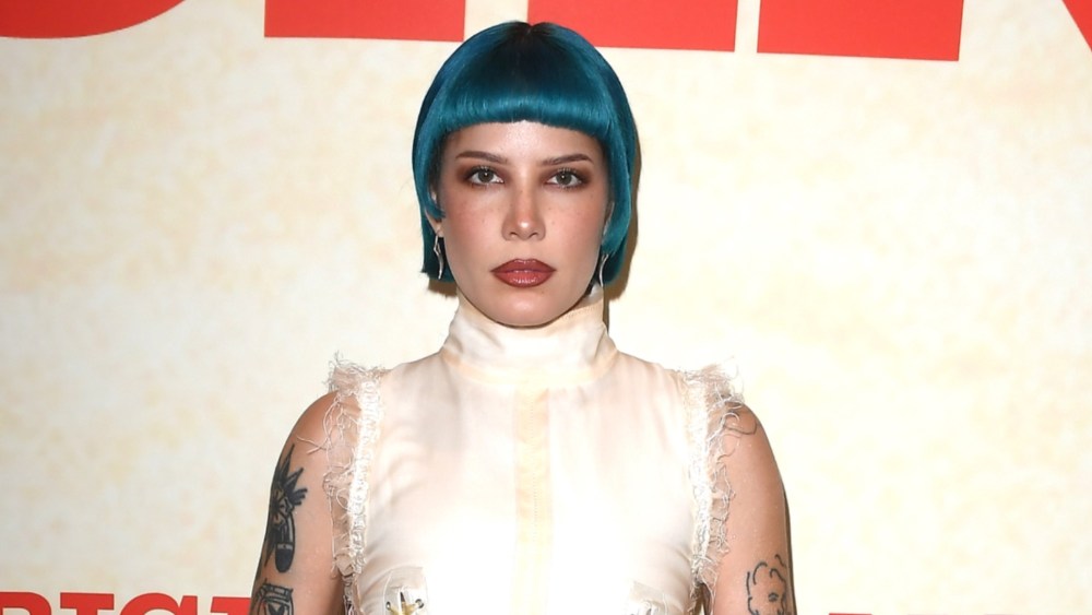 Halsey dons blue hair at the Americana premiere in Los Angeles.