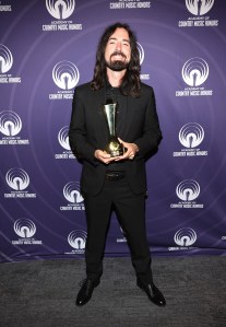 NASHVILLE, TENNESSEE - AUGUST 20: Ian Cripps of "Twisters" poses with the ACM Film Award during the 18th Academy Of Country Music Honors at The Pinnacle on August 20, 2025 in Nashville, Tennessee. (Photo by Terry Wyatt/Getty Images for ACM)