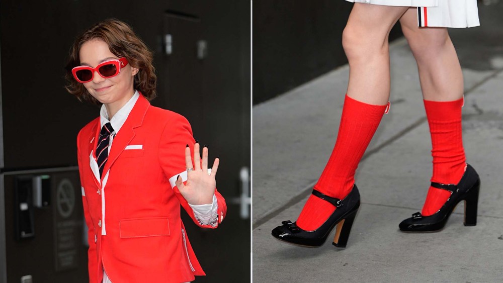 Emma Myers pairs black Mary Jane high heels with bright red knee-high socks in New York City on Wednesday.