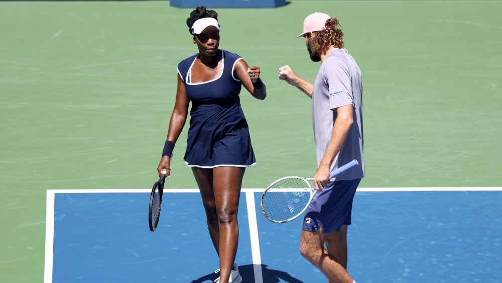 Venus Williams wears a custom Khaite tennis kit and Lacoste sneakers during her and Reilly Opelka's U.S. Open mixed doubles first round match on Aug. 19, 2025 in New York City.