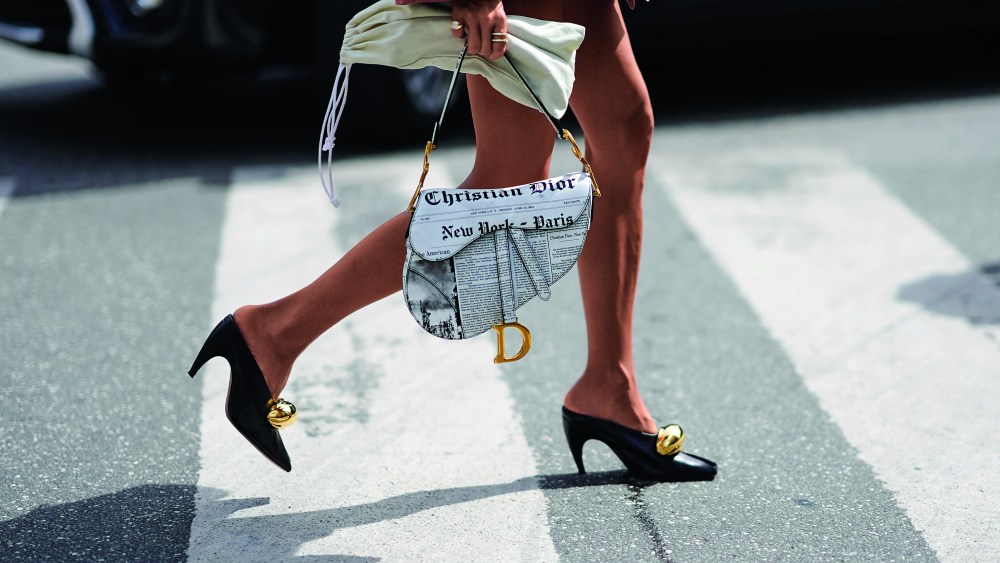 COPENHAGEN, DENMARK - AUGUST 08: A guest wears pointed shoes and a Dior Newspaper Saddle bag, during day four of the Copenhagen Fashion Week (CPHFW) SS25 on August 08, 2024 in Copenhagen, Denmark. (Photo by Edward Berthelot/Getty Images)