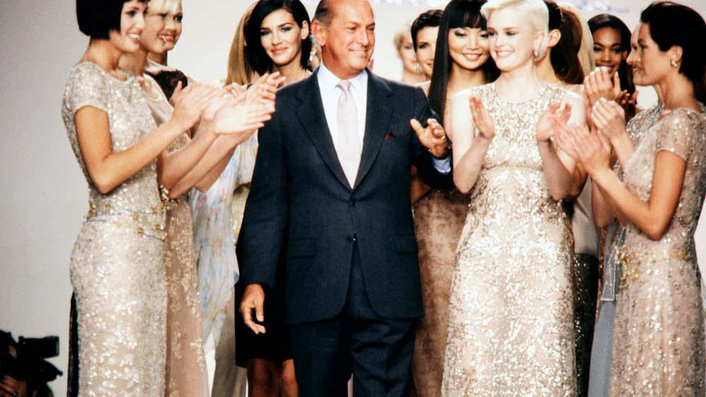 Models and audience applaud designer Oscar de la Renta at show finale.