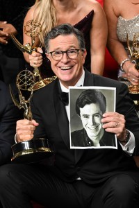 Stephen Colbert poses with the Outstanding Talk Series award for “The Late Show With Stephen Colbert” at the 77th Primetime Emmy Awards.