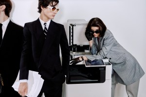 Brunson (left): Loewe signature double frame, acetate frame and metal rim with anagram logo; Emporio Armani wool jacket; Gucci cotton shirt; Ralph Lauren Purple Label pants; Giorgio Armani velvet tie; Scarosso shoes; Schiaparelli handbag.Addison: Prada acetate sunglasses; Gucci wool jacket; Emporio Armani cotton shirt and wool pants; Brooks Brothers tie; Ralph Lauren Purple Label shoes.Erika (right): Balenciaga bio nylon and bio injection double frames; Stella McCartney RWS wool dress and boots; Kiki De Montparnasse silk bra with lace insets; Versace calf leather gloves; Lele Sadoughi sapphire drop earring; Jennifer Behr gold-plated earring.