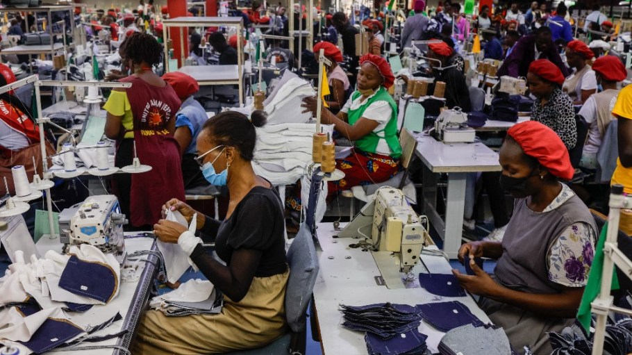 Garment workers in Nairobi, Kenya, sewing Levi's and Wrangler jeans.