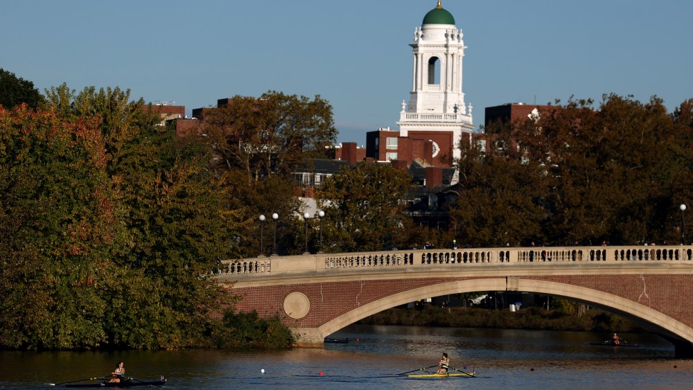 CAMBRIDGE, MASSACHUSETTS - OCTOBER 18: Athletes row under the John W. Weeks Footbridge passing Harvard University campus during the Head of the Charles Regatta 2025 on the Charles River on October 18, 2025 in Cambridge, Massachusetts.  (Photo by Maddie Meyer/Getty Images)